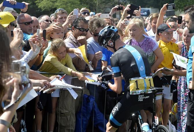 Chris Froome takes some time for autographs