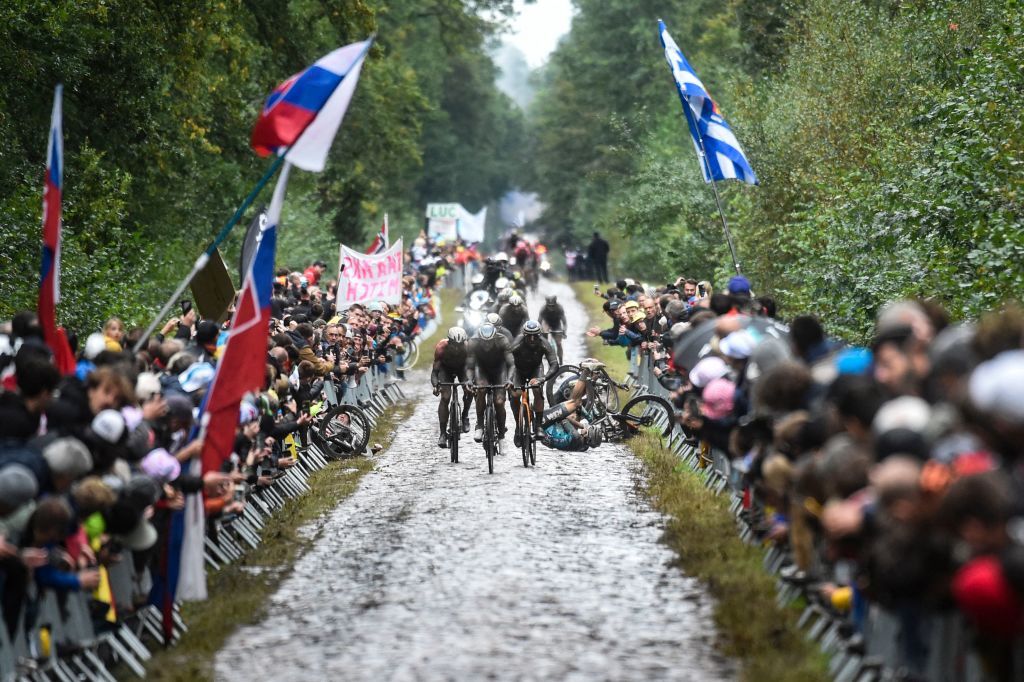 A competitors falls during the 118th edition of the ParisRoubaix oneday classic cycling race between Compiegne and Roubaix northern France on October 3 2021 Photo by FRANCOIS LO PRESTI AFP Photo by FRANCOIS LO PRESTIAFP via Getty Images