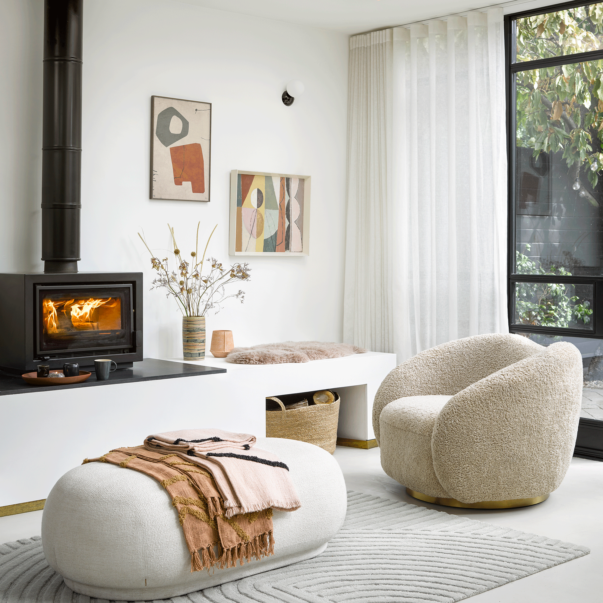 white living room with boucle chair