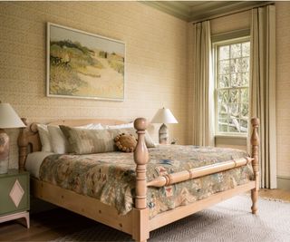 Neutral coloured bedroom with subtly patterned wall and bedspread
