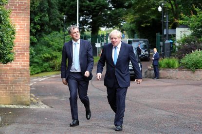BELFAST, NORTHERN IRELAND - JULY 31: Prime Minister Boris Johnson is greeted by Northern Ireland Secretary Julian Smith at Stormont House on July 31, 2019 in Belfast, Northern Ireland. The Pr