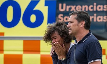 Relatives of passengers involved in Spain's deadly train crash wait for news on July 25, 2013 in Santiago de Compostela.