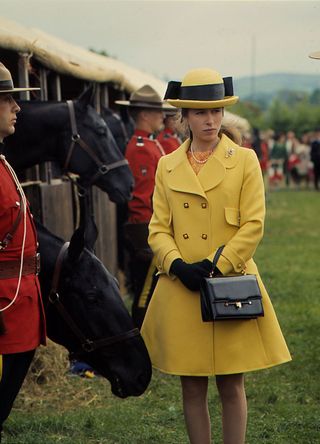 Princess Anne in a yellow coat