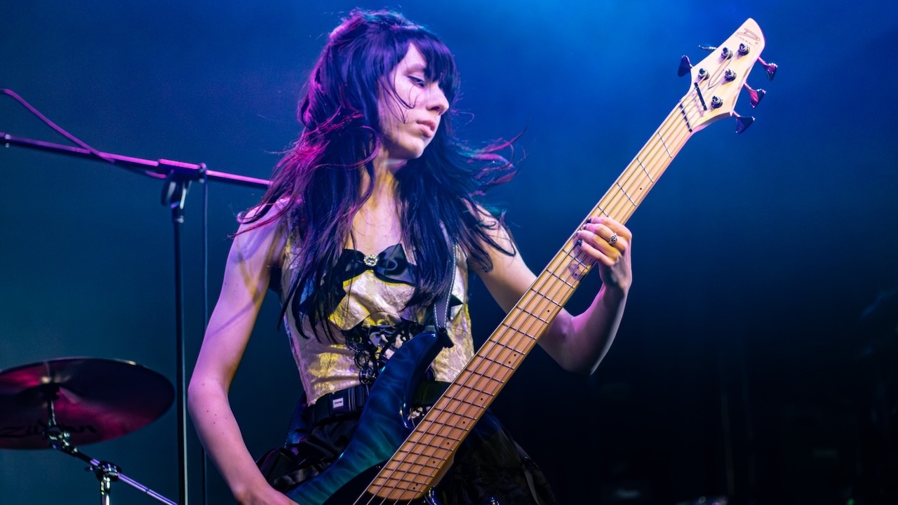 Bassist Aria Becker onstage with Freeze the Fall