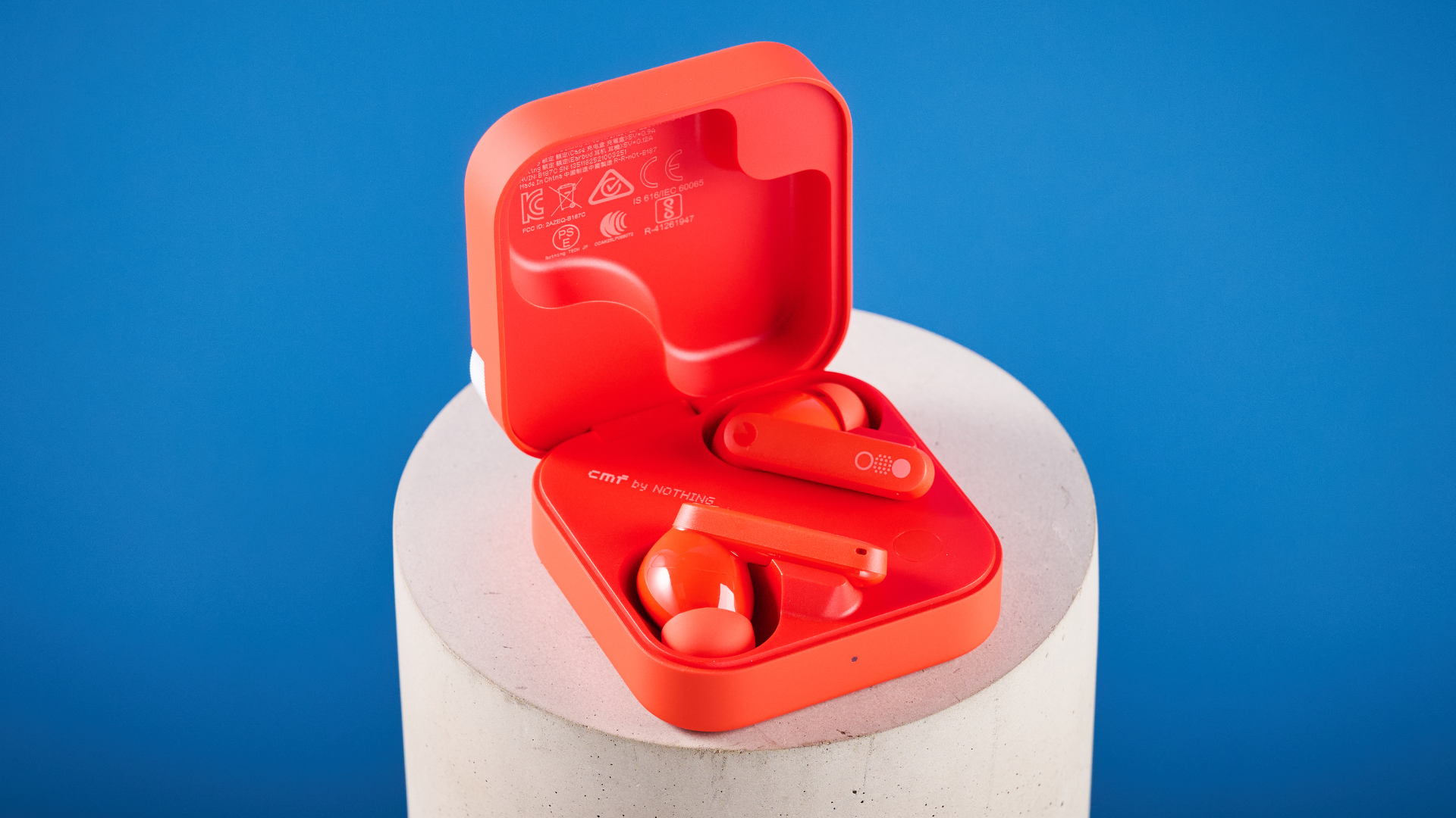 the nothing cmf buds pro 2 cmf by nothing buds pro 2 in bright orange shown in the smart dial charging case against a blue tom&#039;s guide background