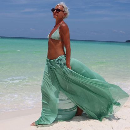 Grece Ghanem in teal bikini and beach cover up