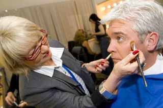 Phillip has another brush with fame as his make-up artist gets busy. Doesn't he scrub up nicely?