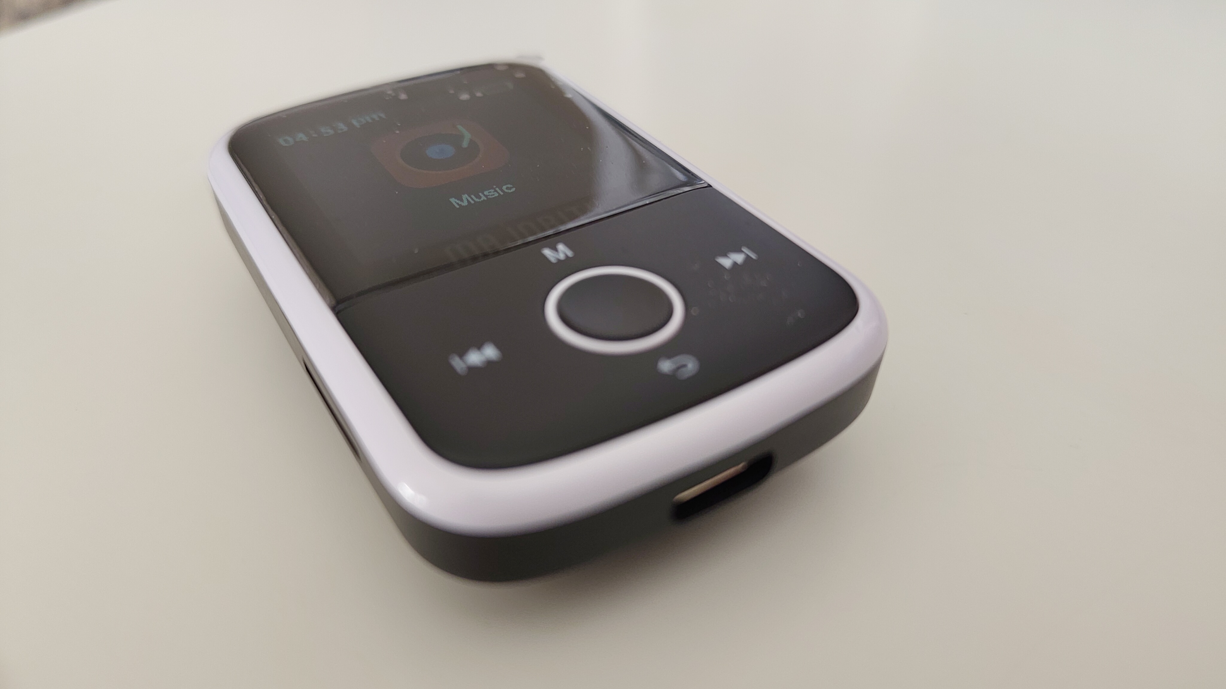 A senior MP3 player on a white desk in a home office