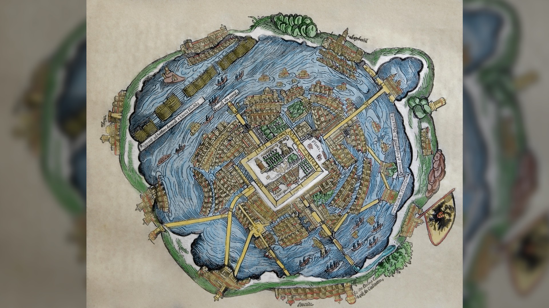 Map of the Aztec capital, Tenochtitlán. In the middle is a square with landmarks that represents Tenochtitlán. Surrounding that are drawings of main roads leading out of the capital and lots of little houses, and then around those is the sea, then more cities.