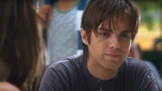 Thomas Dekker sitting in thought in Terminator: The Sarah Connor Chronicles.