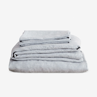 stack of linen sheets in a light blue color