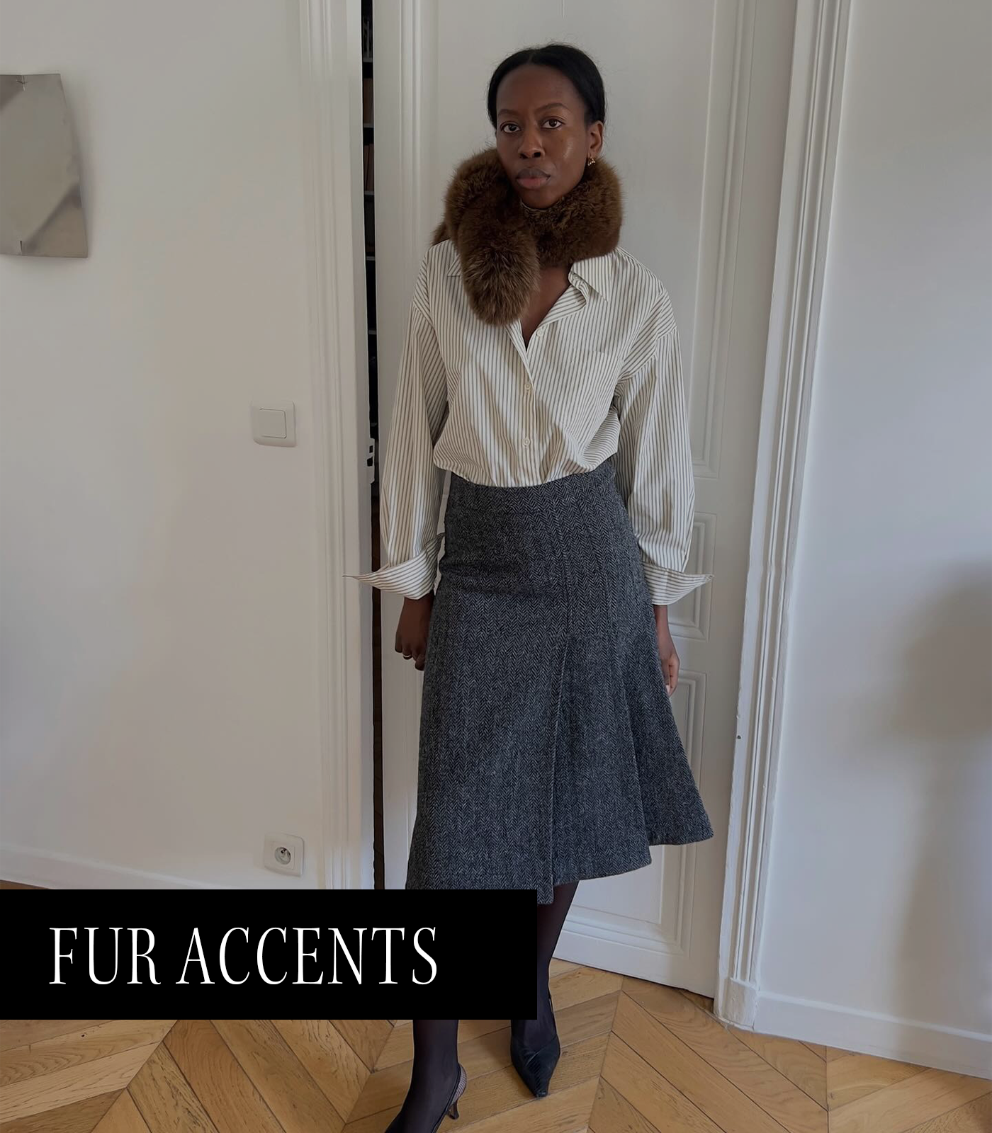 A photo of @sylviemus_ wearing a fur scarf, one of the top 2026 micro trends.