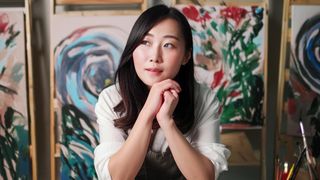 AI generated image of woman sitting in art studio