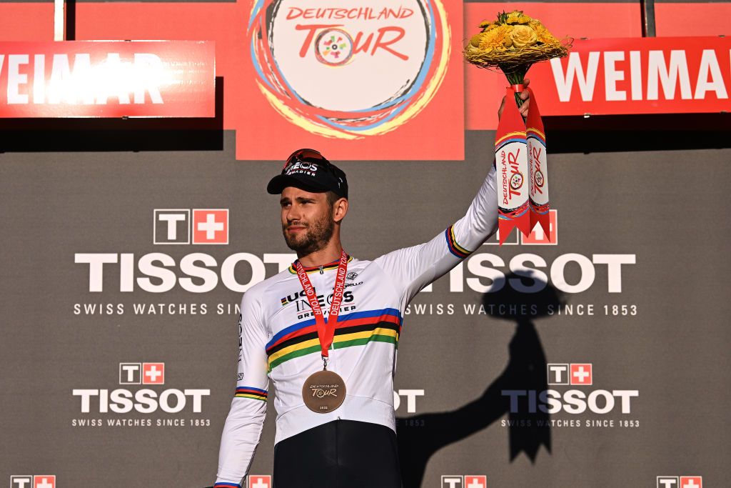 WEIMAR GERMANY AUGUST 24 Filippo Ganna of Italy and Team INEOS Grenadiers celebrates at podium as stage winner during the 37th Deutschland Tour 2022 Prologue a 26km individual time trial from Weimar to Weimar DeineTour on August 24 2022 in Weimar Germany Photo by Stuart FranklinGetty Images