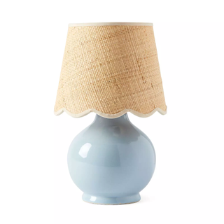 table lamp with scalloped raffia shade and blue ceramic base