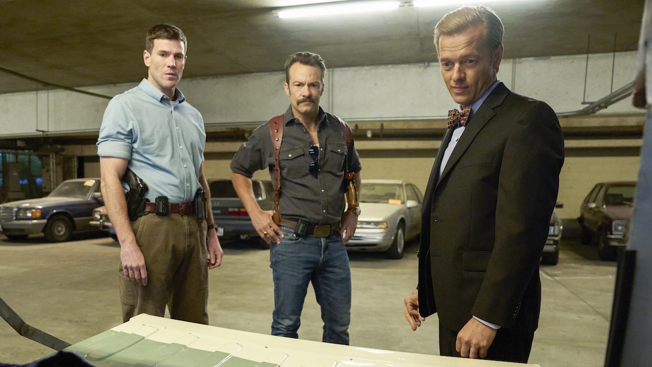Gibbs, Mike Franks and Ducky looking at the skeletal remains in the trunk of Doc Tango's car in NCIS: Origins