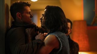 Fangs Fogarty (Drew Ray Tanner) pins Kevin Keller (Casey Cott) agains a wall in Riverdale season 6.