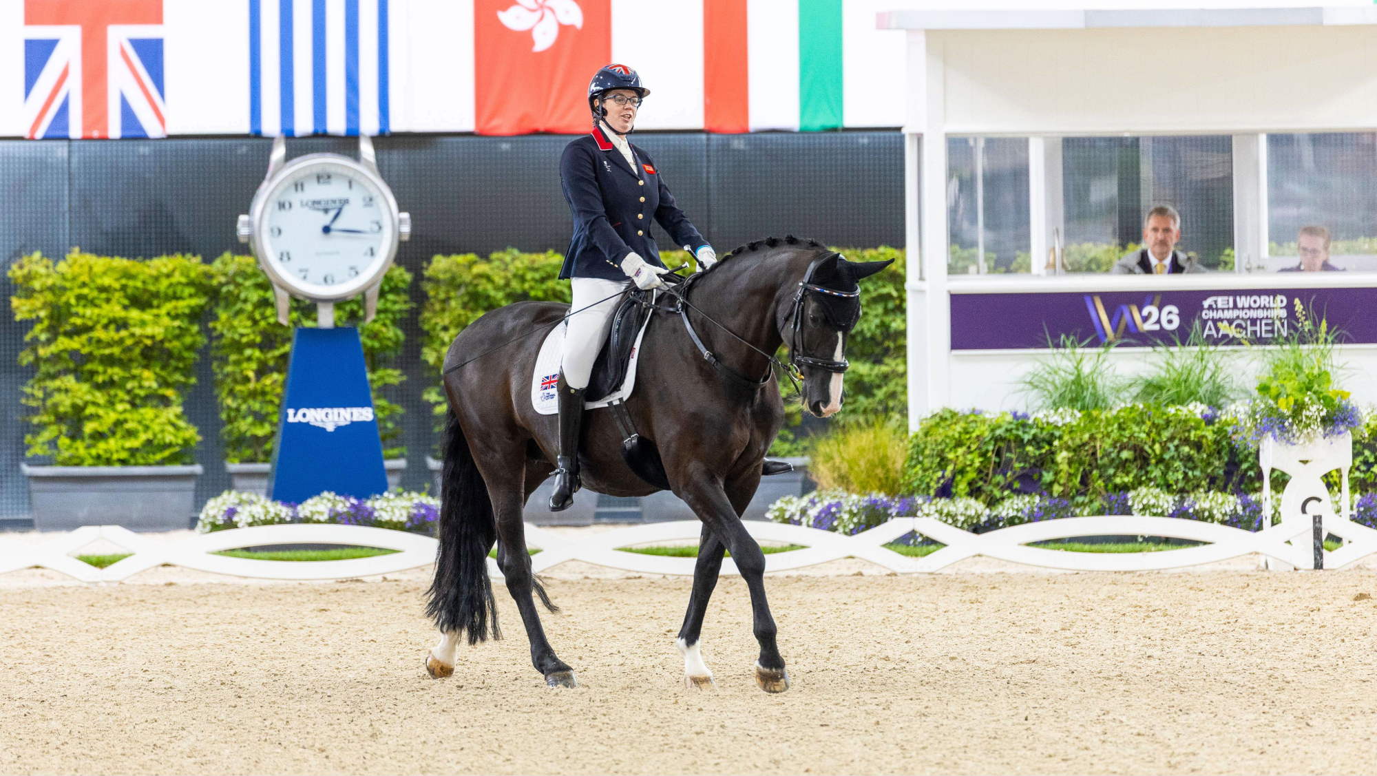 Mari Durward Akhurst riding her horse, Athene Lindebjerg, across the diagonal in walk at the 2026 World Para Dressage Championships in Aachen 