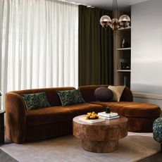 John Lewis Pleat sofa in Ginger Chenille in a minimalist living room with a round burl-effect coffee table in front of it
