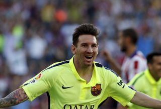 Lionel Messi celebrates after scoring for Barcelona against Atletico Madrid in May 2015.