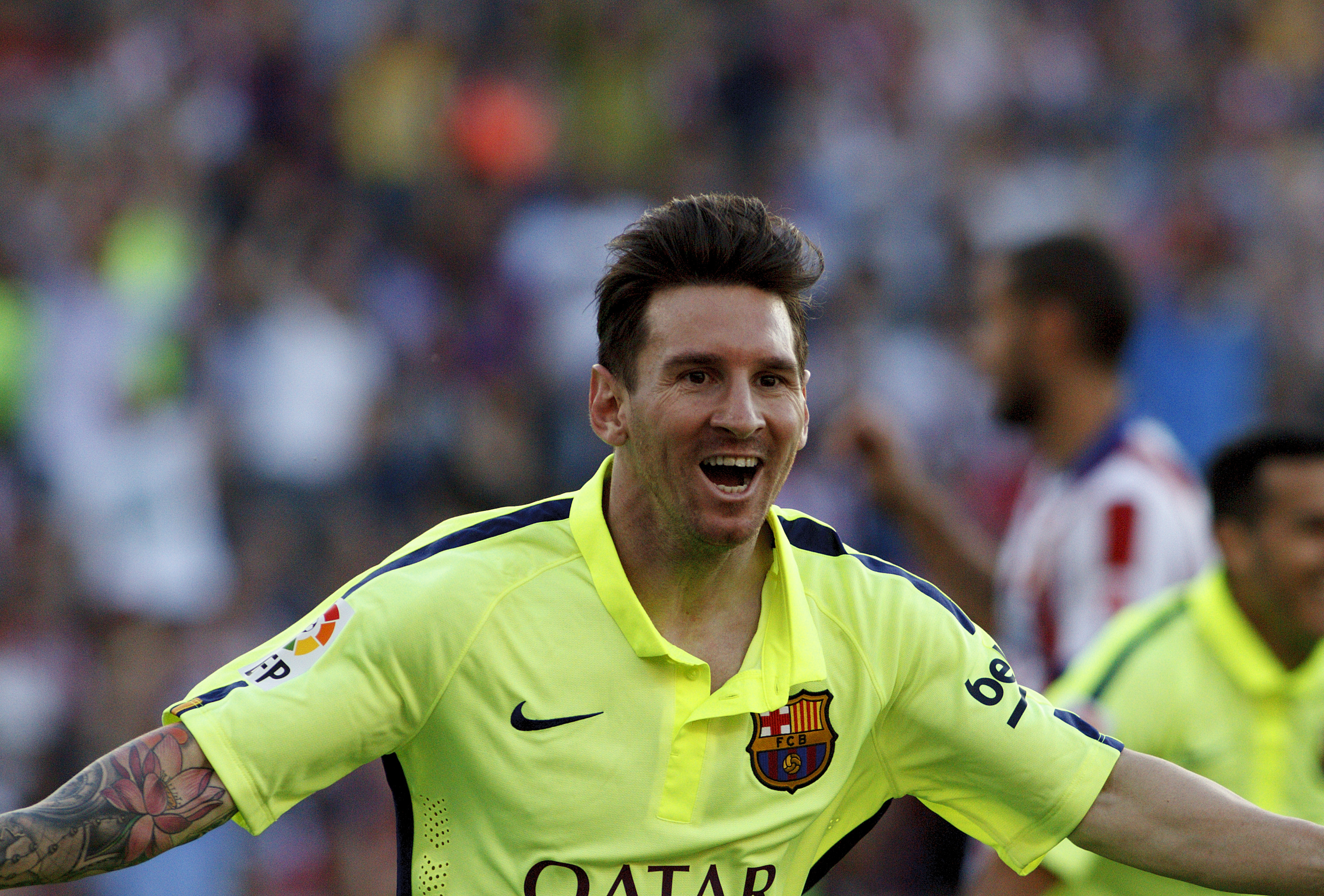 Lionel Messi celebrates after scoring for Barcelona against Atletico Madrid in May 2015.