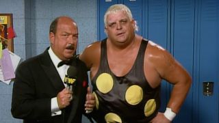 Dusty Rhodes is interviewed by Mean Gene while rocking polka dots.