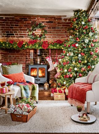 Traditional living room with wood burning stove, christmas tree and brick wall fire place