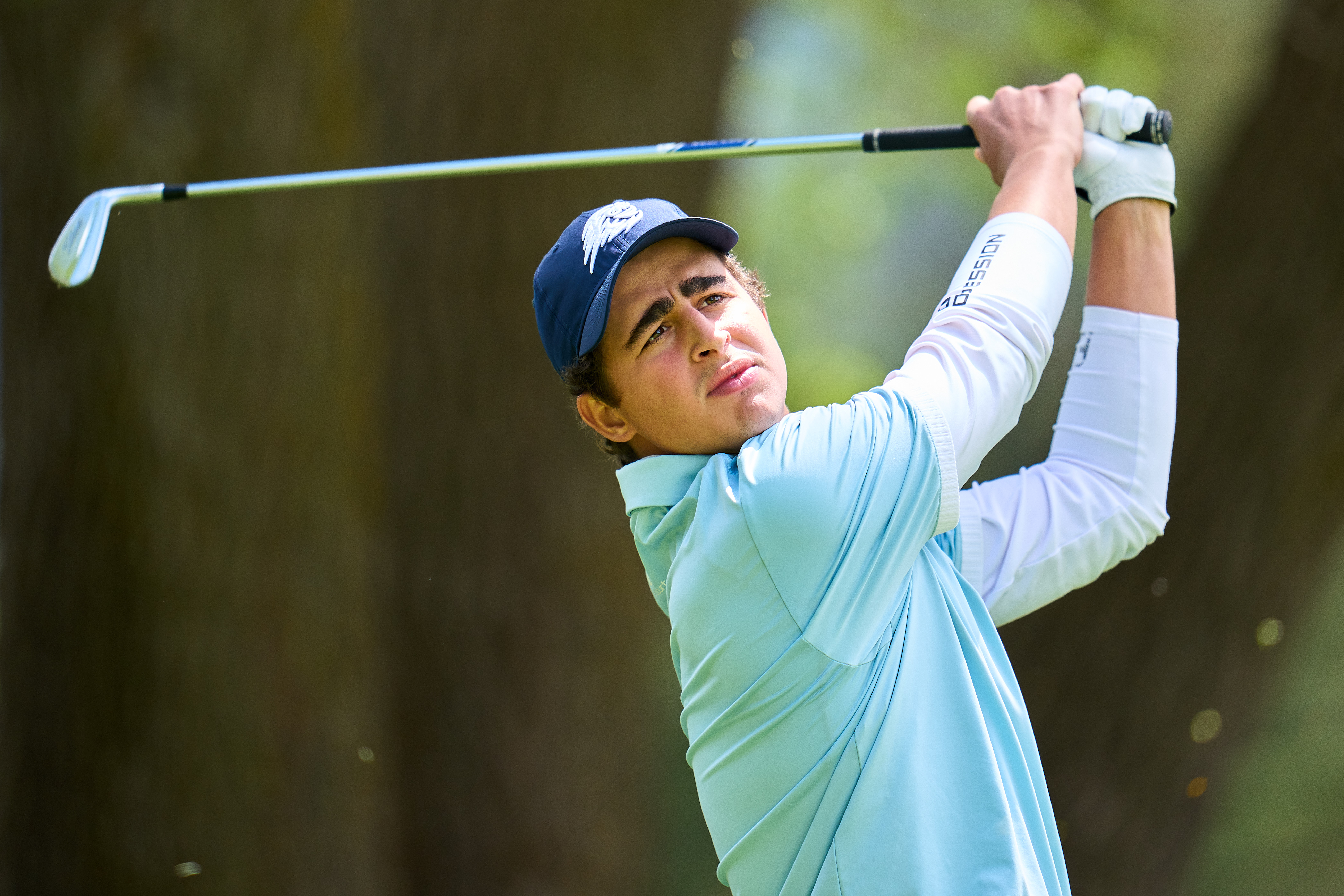 Luis Masaveu hits an iron shot into the green