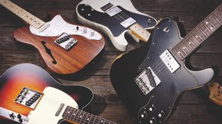 A group of Fender Telecasters laying on the ground