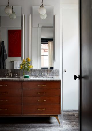 Stained wood sink draws, twin sinks and mirrors