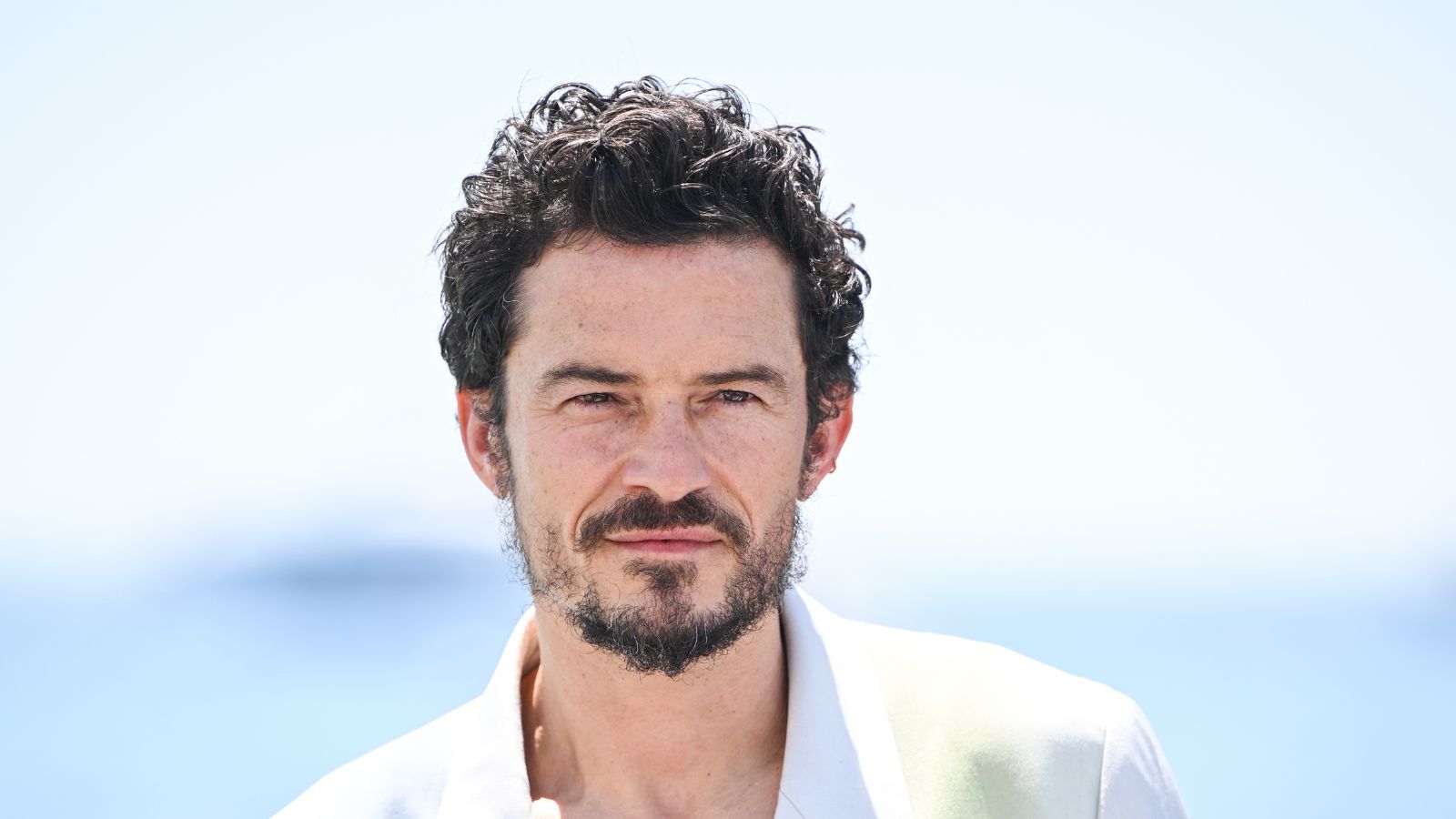 orlando bloom on a blue background