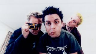 Green Day gurning at the camera in 1997