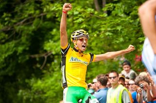 Jesse Anthony (Kelly Benefit Strategies-OptumHealth) crosses the finish and celebrates his overall victory in the Nature Valley Grand Prix