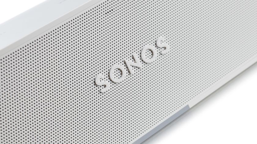 The Sonos logo on the white speaker grille of a Sonos device.