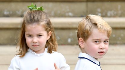 Princess Charlotte of Cambridge and Prince George of Cambridge attend the wedding of Princess Eugenie of York and Jack Brooksbank at St George's Chapel on October 12, 2018 in Windsor, England