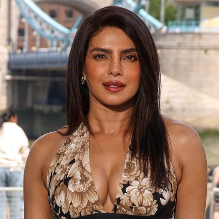 Priyanka Chopra wearing a halter neck dress and posing for the camera.