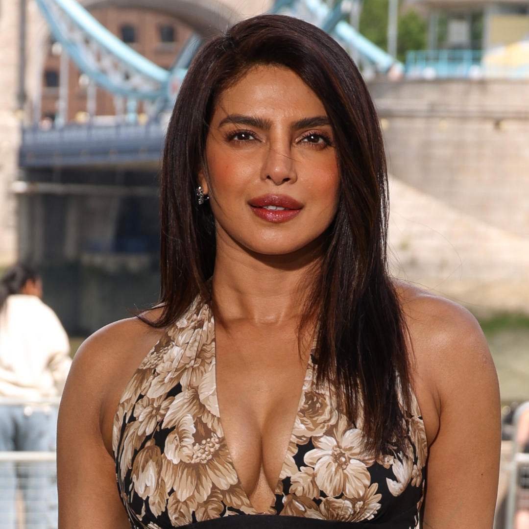 Priyanka Chopra wearing a halter neck dress and posing for the camera.