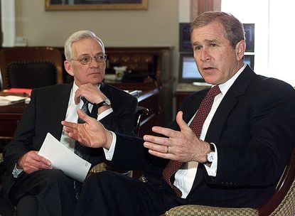 Paul O'Neill and George W. Bush.