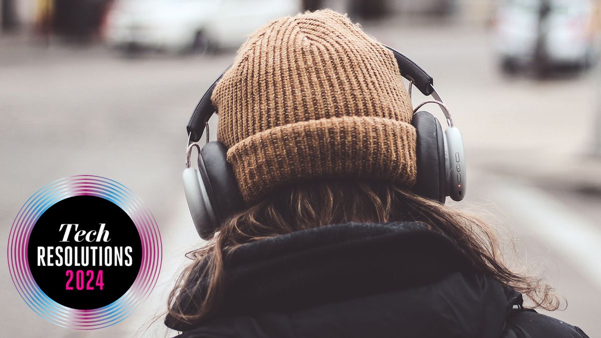 Someone wearing a hat and headphones