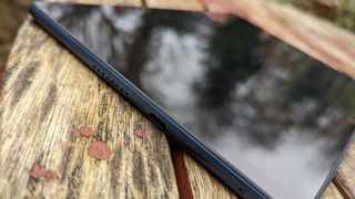 A blue-backed Honor Pad X8 tablet on a wooden table