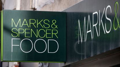 A Marks & Spencer Food logo is seen on the facade of the closed Marks & Spencer Food store on 'Chaussee d'Antin' on February 12, 2021