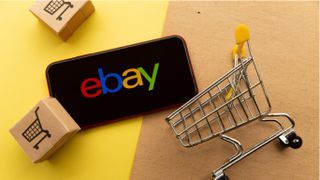 eBay logo next to shopping cart and boxes