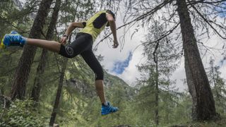 best trail running socks: A trail running racing through some woods