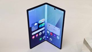 A semi-folded Samsung Galaxy Z Fold 7 displayed on a counter