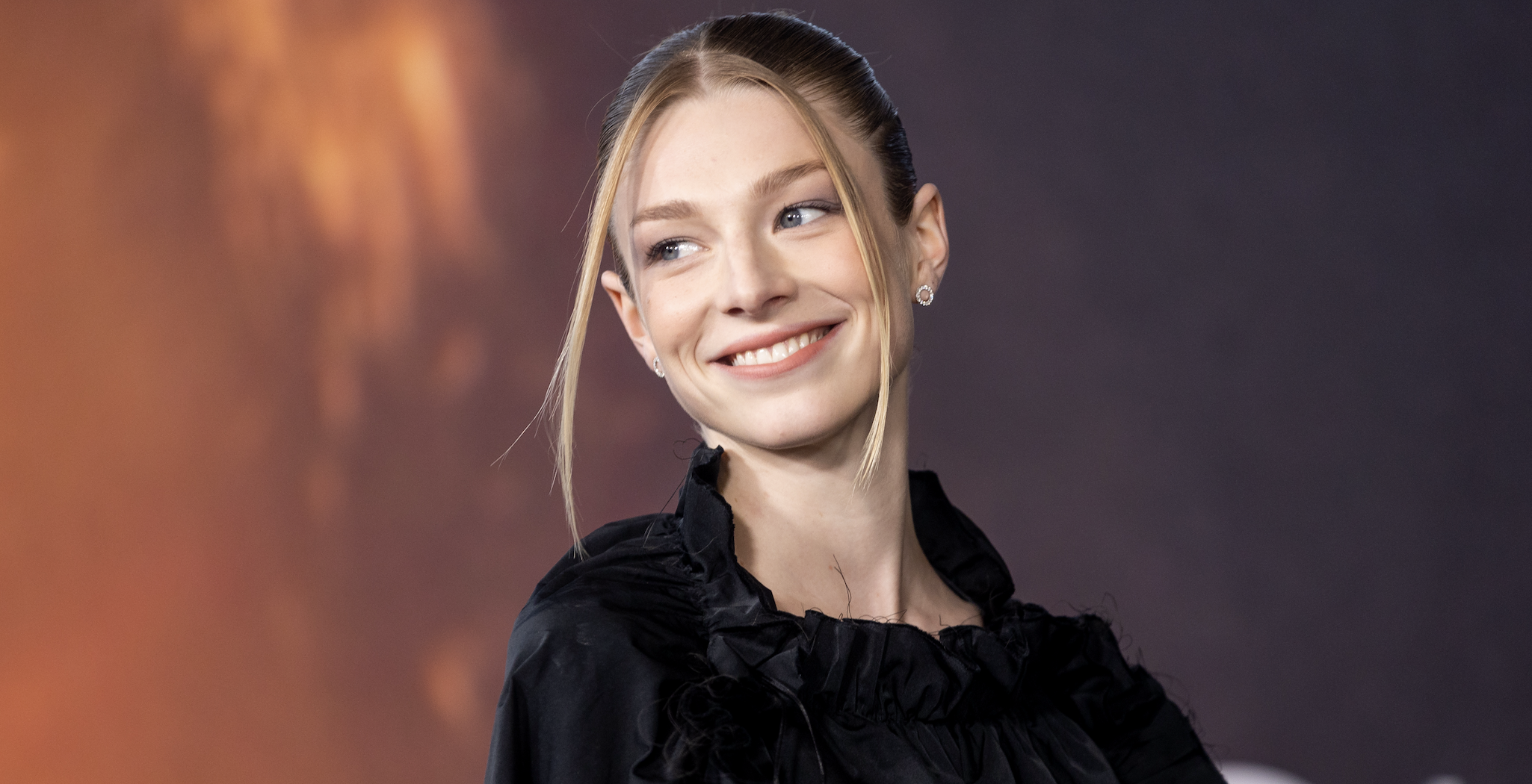 hunter schafer smiles on the red carpet