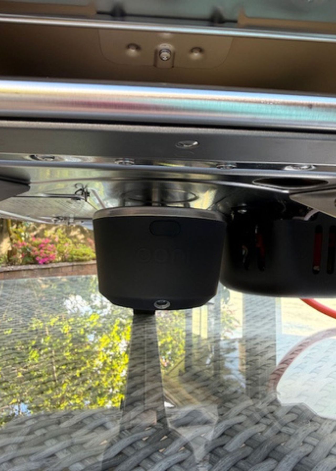 A side view of the underside of the Ooni Koda 2, showing the motor for the rotating stone