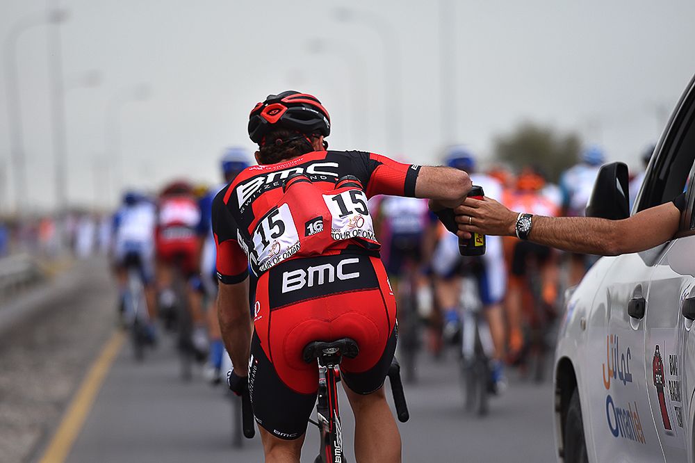 BMC's Joey Rosskopf gets a bottle from the team car.