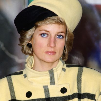 Princess Diana wears a yellow and black checked coat