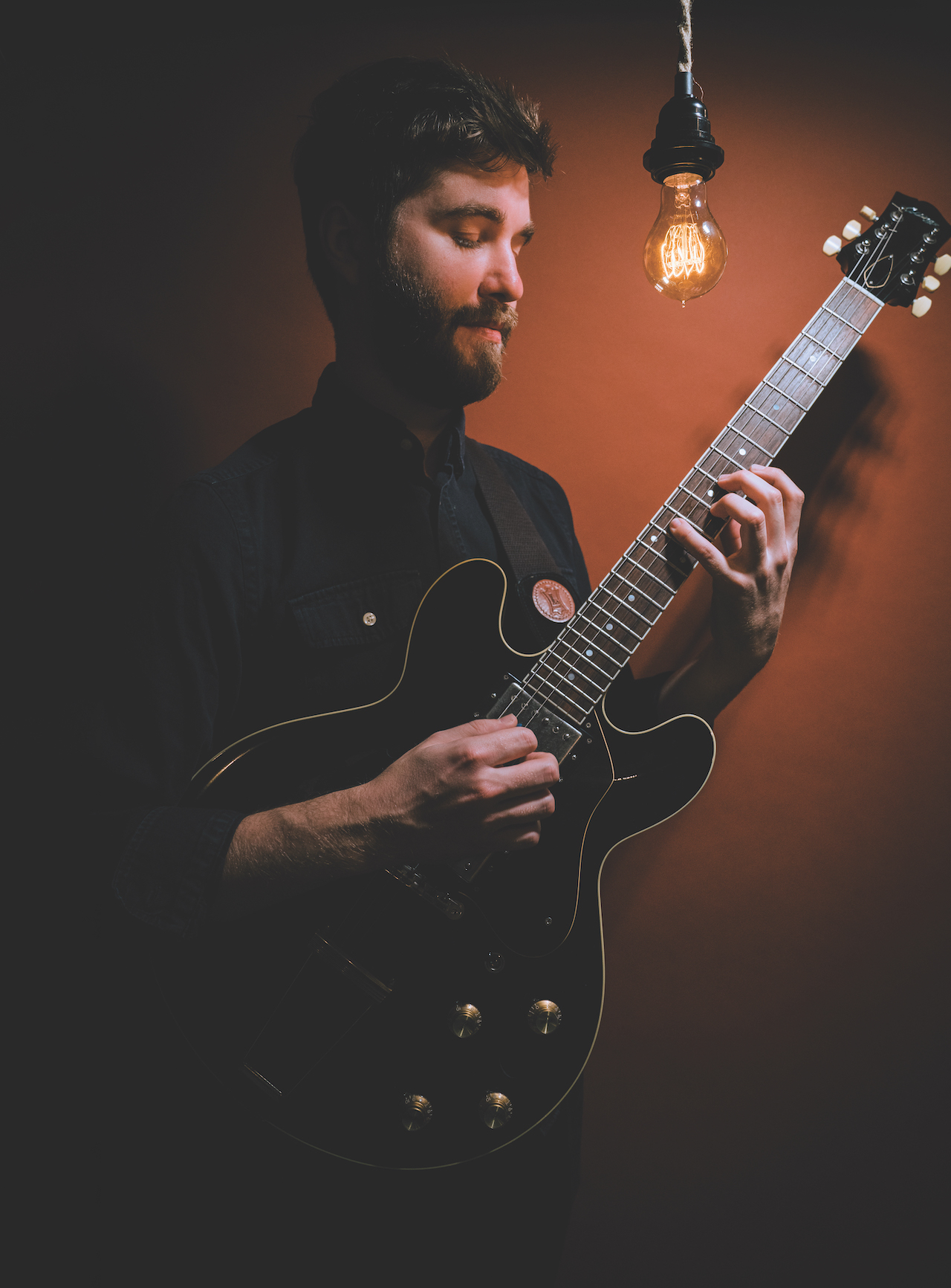 Max Light, pictured holding his beloved Collings I-30