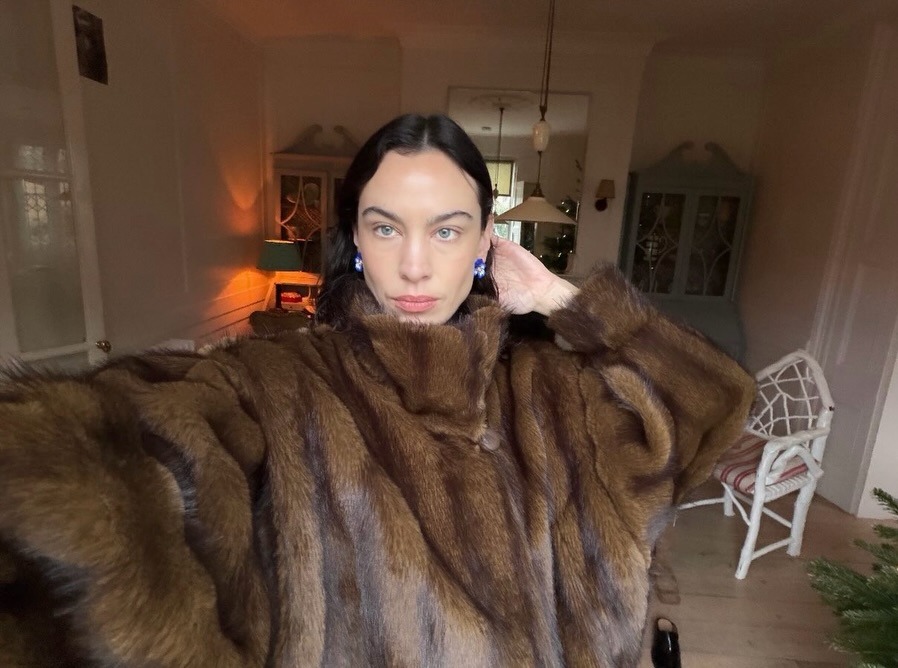 Alexa Chung wears a brown fur coat.